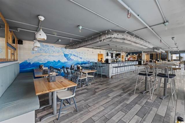 dining area with hardwood / wood-style floors