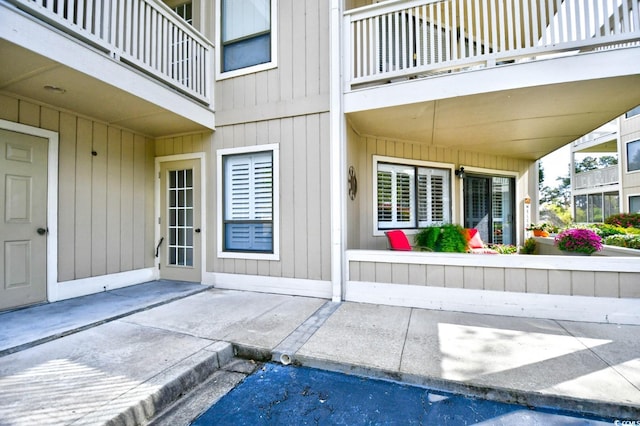 entrance to property with a balcony