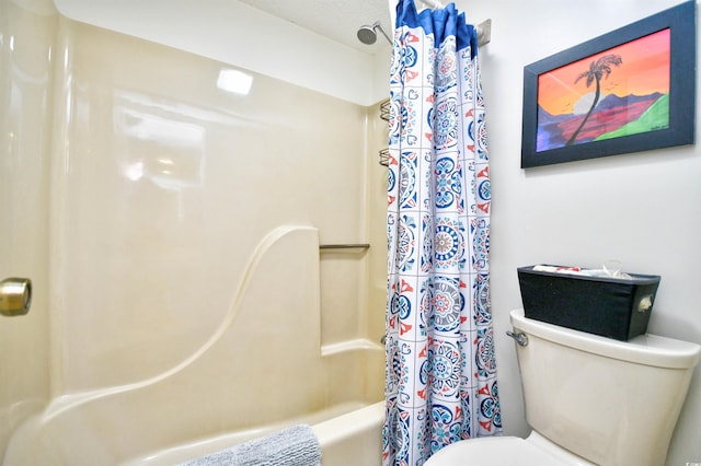 bathroom with toilet and shower / tub combo with curtain