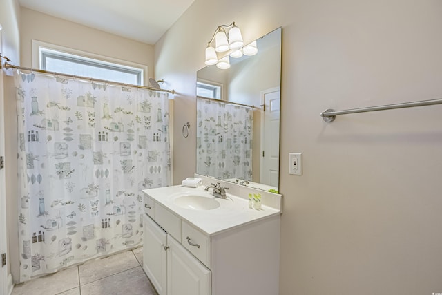 bathroom featuring a shower with curtain, vanity, and tile patterned flooring