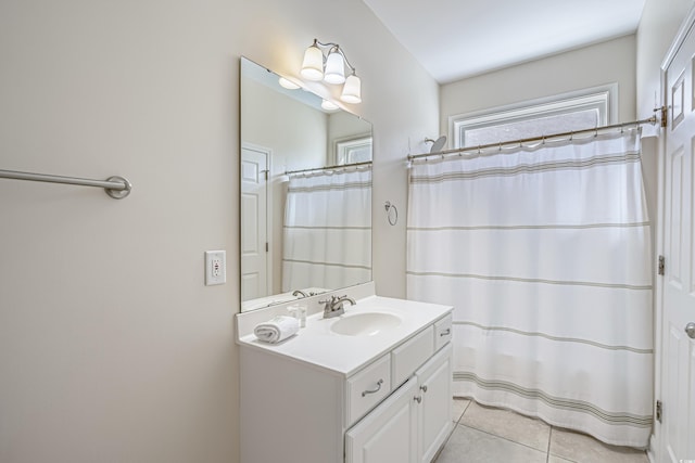 bathroom featuring tile patterned flooring and vanity