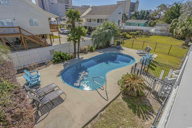 view of swimming pool featuring a patio area