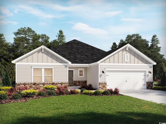 view of front of property with a garage and a front lawn