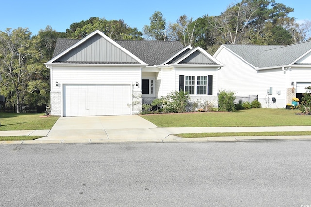 view of front facade with a garage and a front lawn