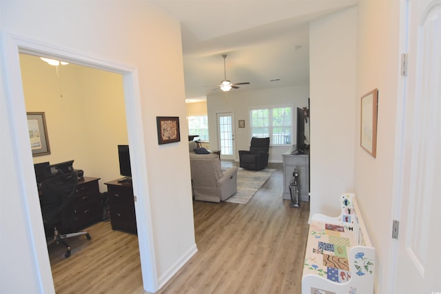 corridor featuring light hardwood / wood-style floors