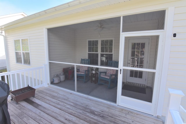 wooden deck with ceiling fan