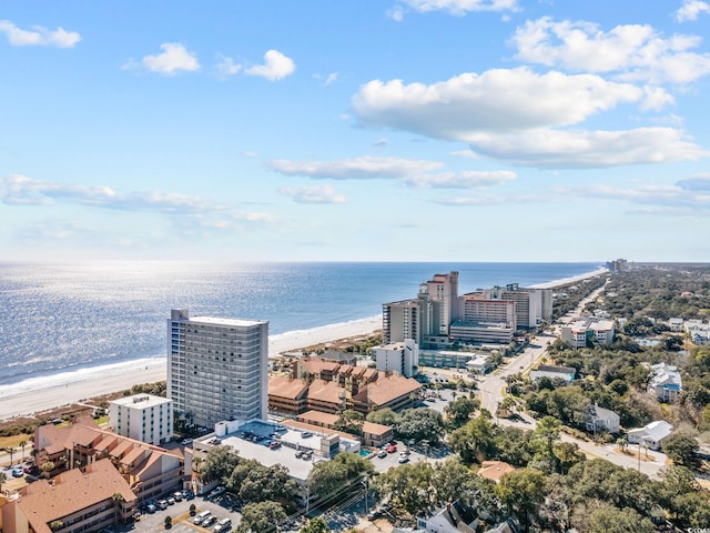 aerial view with a water view and a beach view