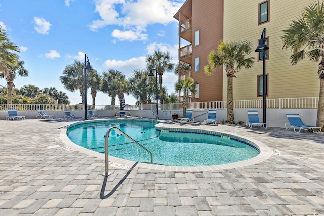 view of swimming pool featuring a patio area