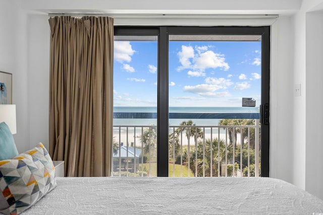 bedroom featuring a water view