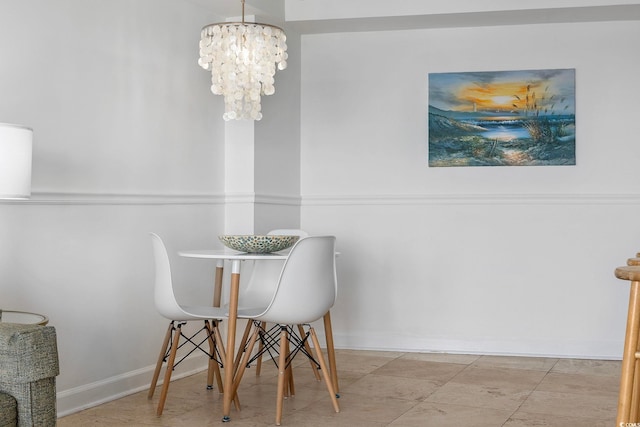 dining space with a chandelier