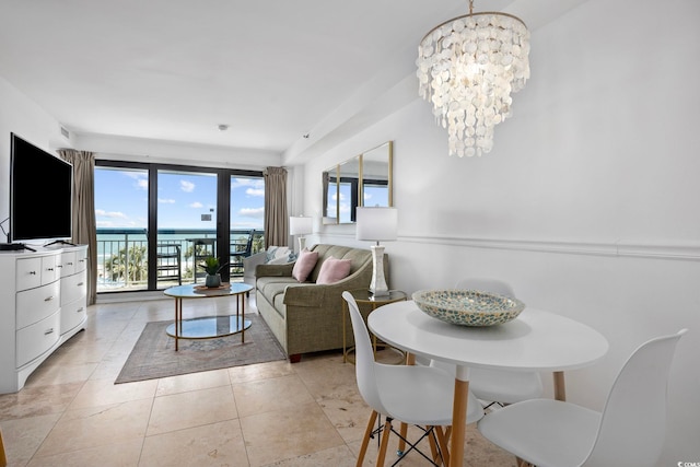 tiled dining room with a notable chandelier