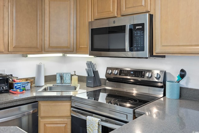 kitchen featuring appliances with stainless steel finishes and sink