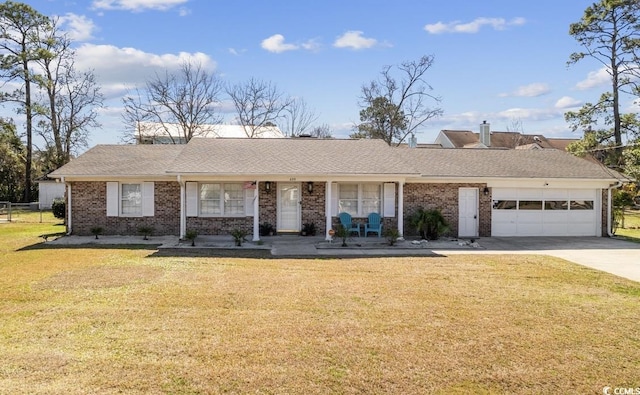 ranch-style house with a garage and a front yard