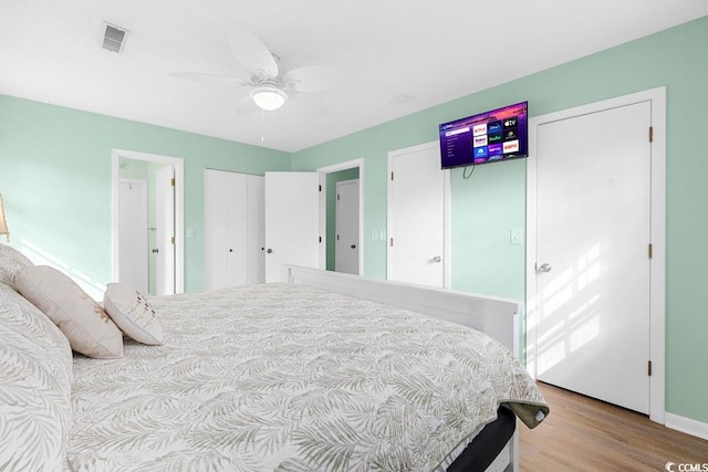 bedroom featuring light wood-type flooring and ceiling fan