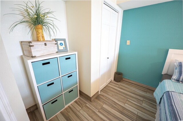 4800 S Ocean Blvd Unit 1522, North Myrtle Beach, SC 29582 - bedroom featuring light wood finished floors and baseboards
