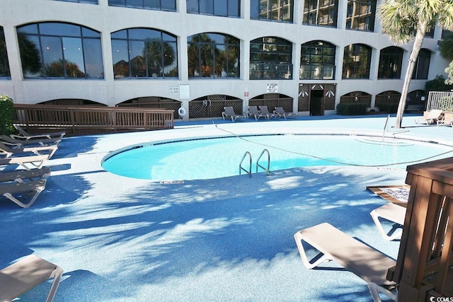 view of swimming pool with a patio area