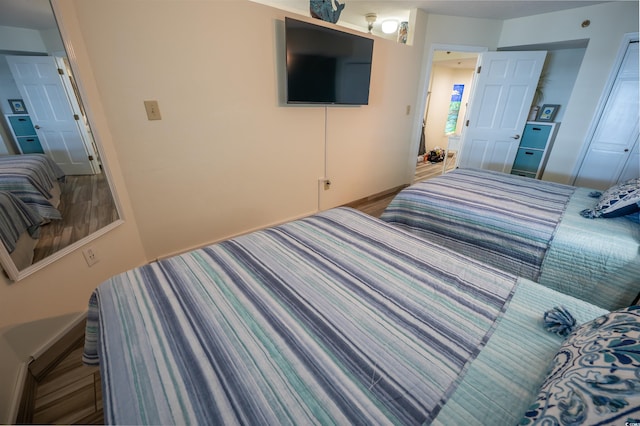 4800 S Ocean Blvd Unit 1522, North Myrtle Beach, SC 29582 - bedroom featuring baseboards and wood finished floors