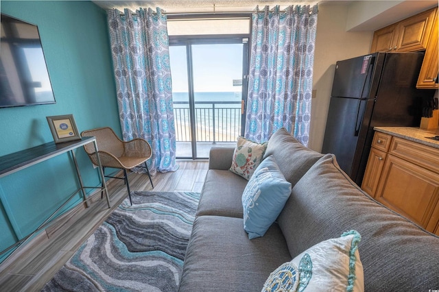 4800 S Ocean Blvd Unit 1522, North Myrtle Beach, SC 29582 - living room with light wood finished floors and a water view