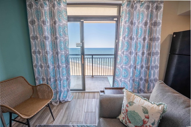 4800 S Ocean Blvd Unit 1522, North Myrtle Beach, SC 29582 - living area featuring a water view and wood finished floors