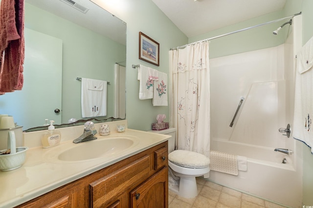 full bathroom featuring toilet, vanity, and shower / bath combo with shower curtain