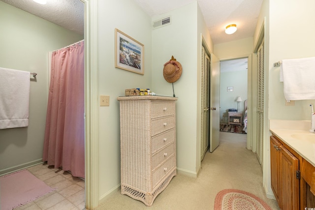206 56th Ave N, North Myrtle Beach, SC 29582 - bathroom with vanity, baseboards, and a shower with curtain