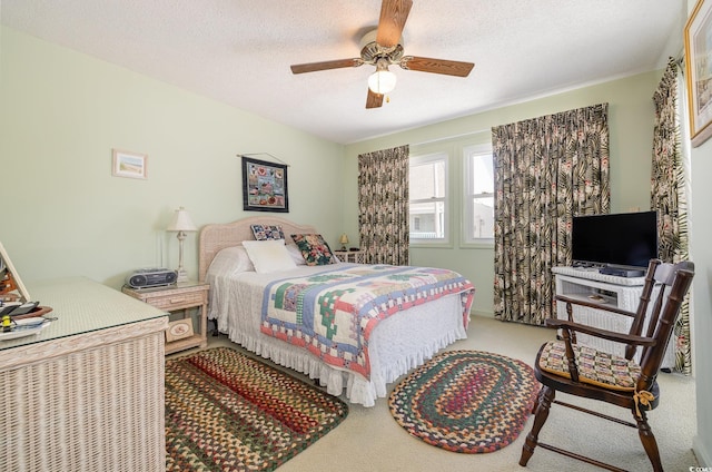 206 56th Ave N, North Myrtle Beach, SC 29582 - carpeted bedroom with ceiling fan and a textured ceiling