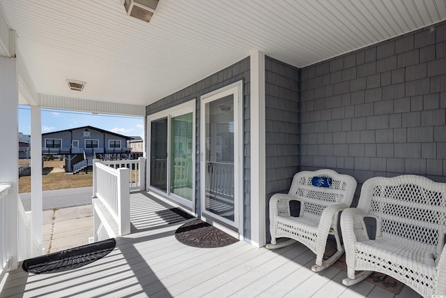 206 56th Ave N, North Myrtle Beach, SC 29582 - wooden porch with a residential view