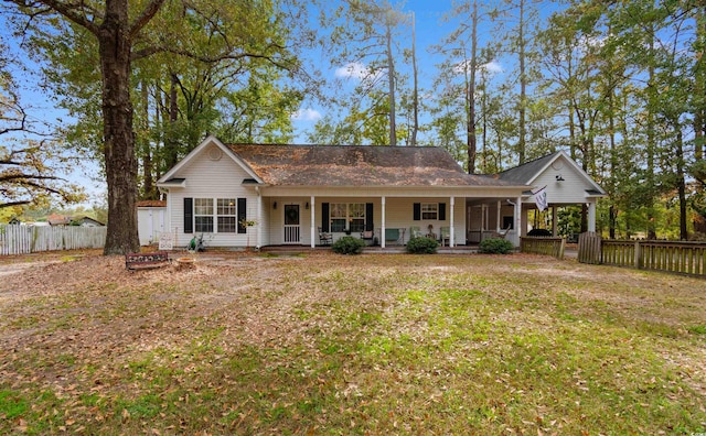 view of front of house with covered porch and a front yard