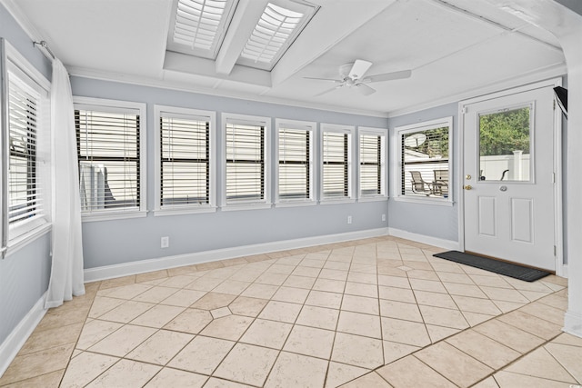 unfurnished sunroom featuring ceiling fan