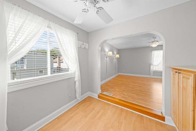 spare room with light hardwood / wood-style flooring and ceiling fan