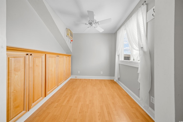 bonus room with ceiling fan and light hardwood / wood-style floors