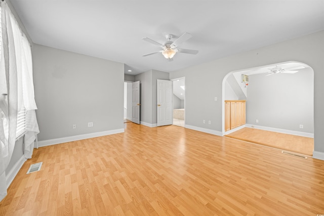 spare room with ceiling fan and light hardwood / wood-style flooring