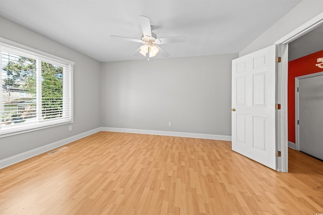 spare room featuring ceiling fan and light hardwood / wood-style floors