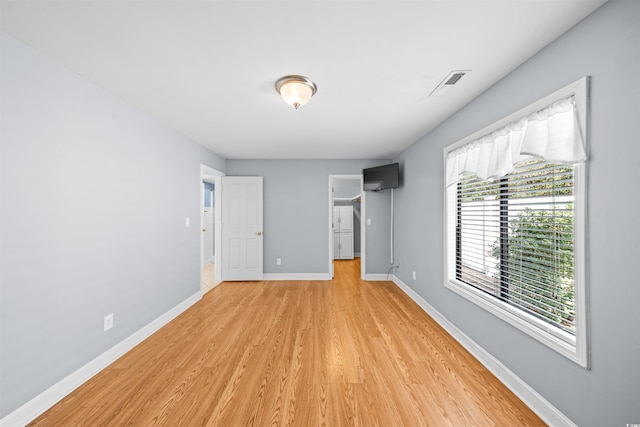 unfurnished bedroom featuring light hardwood / wood-style flooring