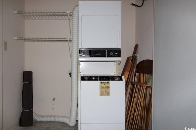 laundry area with stacked washing maching and dryer