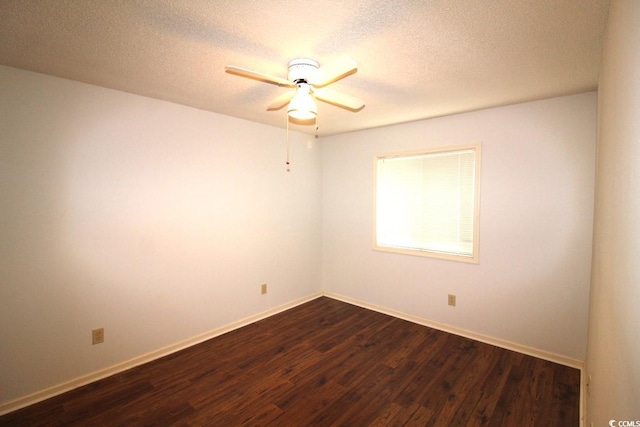 spare room featuring ceiling fan, a textured ceiling, and dark hardwood / wood-style flooring