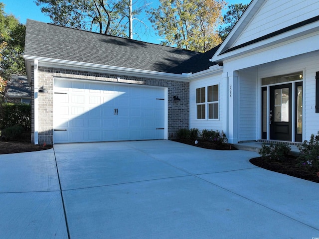 view of property exterior with a garage