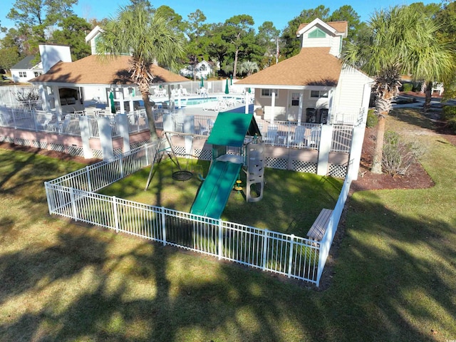 exterior space featuring a yard and a pool side deck