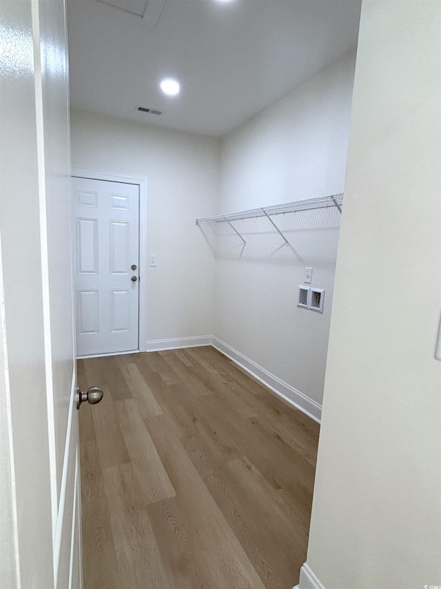 washroom with hookup for a washing machine and wood-type flooring