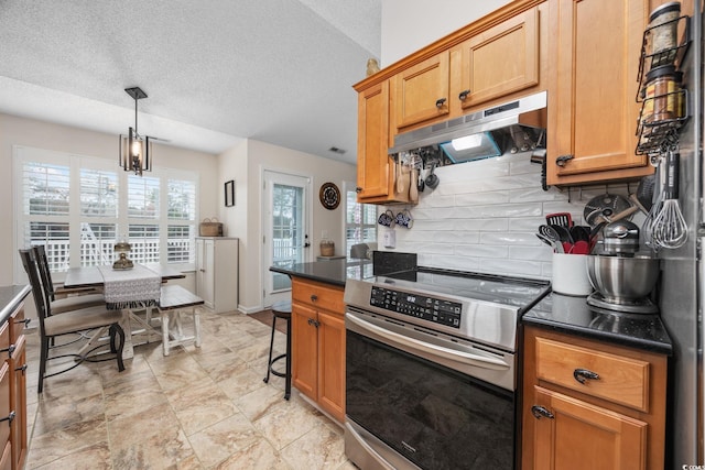 kitchen featuring backsplash, decorative light fixtures, a textured ceiling, and electric range