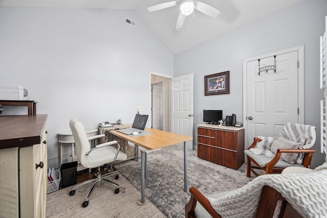 carpeted office with high vaulted ceiling and ceiling fan