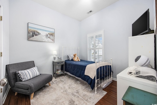 bedroom with hardwood / wood-style floors