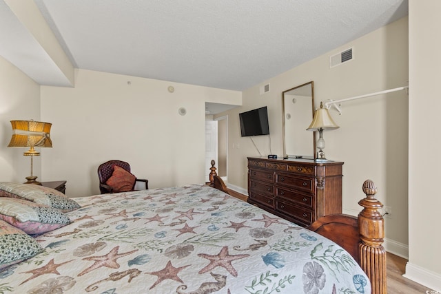 2709 Ocean Blvd S Unit 1202, Myrtle Beach, SC 29577 - bedroom featuring wood finished floors and baseboards