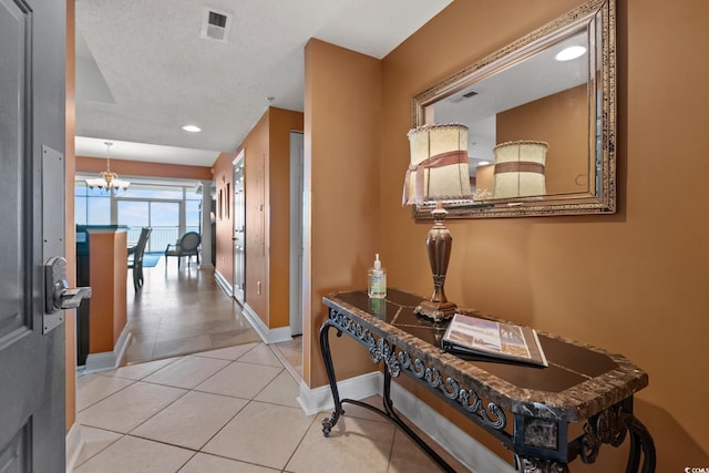 2709 Ocean Blvd S Unit 1202, Myrtle Beach, SC 29577 - hallway with baseboards, tile patterned floors, a chandelier, and recessed lighting