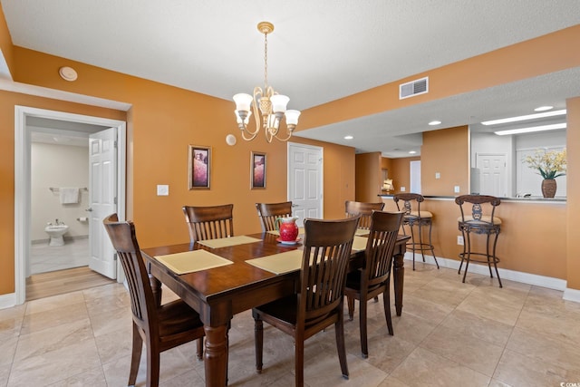 2709 Ocean Blvd S Unit 1202, Myrtle Beach, SC 29577 - dining space with baseboards, a chandelier, and light tile patterned floors