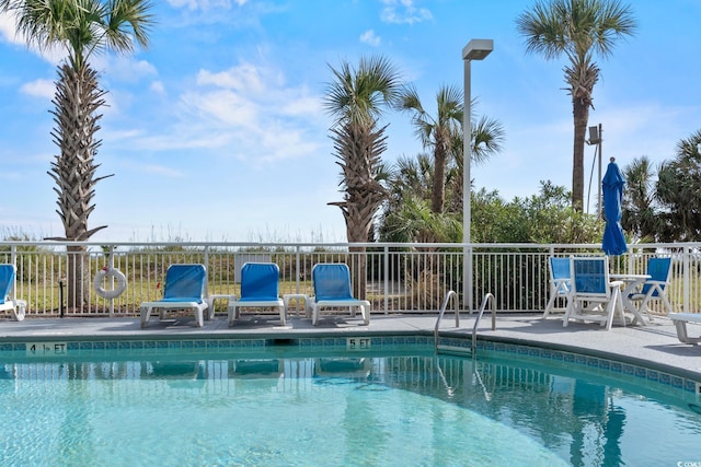 2709 Ocean Blvd S Unit 1202, Myrtle Beach, SC 29577 - community pool with fence and a patio