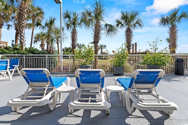 2709 Ocean Blvd S Unit 1202, Myrtle Beach, SC 29577 - view of patio with a swimming pool and fence