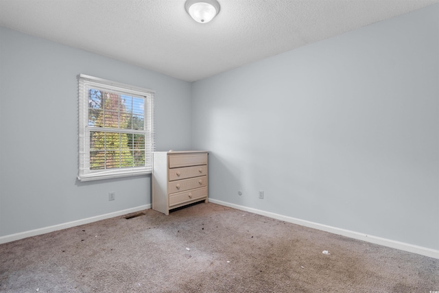 4505 N Kings Hwy Unit C3, Myrtle Beach, SC 29577 - spare room with carpet flooring and a textured ceiling