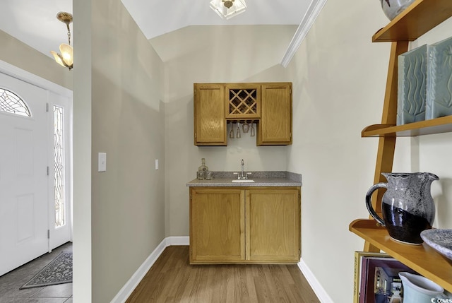 153 Garden Ave, Georgetown, SC 29440 - indoor wet bar with vaulted ceiling, baseboards, and light wood finished floors