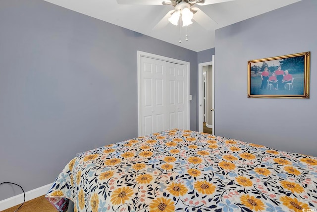 bedroom with ceiling fan and a closet